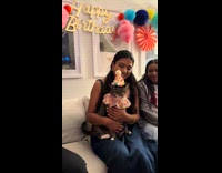 Family singing happy birthday cat 