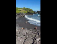 Woman bikini with cap poses at beach