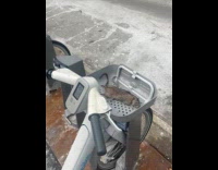 Rat on citibike basket with flat tire