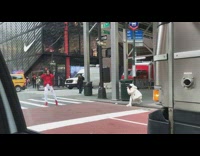 Girl standing on crosswalk turns flips hair  