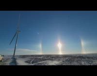 Sun in a diamond shape with a ring that surrounds it