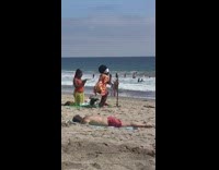 Woman bikini orange robe pose on beach