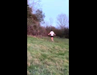 Man in white shirt jump ropes at the fields