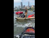 Woman wears leopard bodysuit rides jet ski