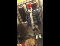 man on drums guy blue jacket red hat dancing