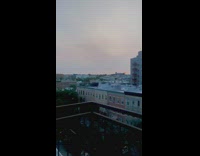 Large red orange sun rooftop wildfires ash 