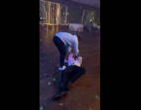 Man lift another man and fell down