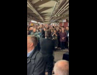 Ed Sheeran and Jimmy Fallon performing at subway station 