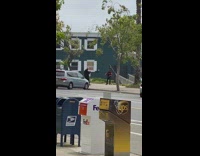 Guy red sleeves rap street UPS mailbox