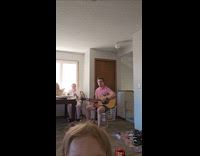 Couple practicing for performance toddler grabs camera 