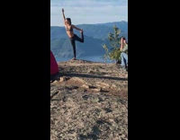 Girl holds and lifts leg behind head 