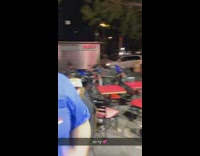 Guy wearing horse mask plays guitar cops at pizza restaurant 