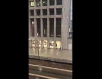 Teenager dance front building raining