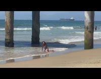 Woman white bikini split butt slap beach seaside