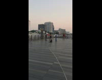 Couple poses for photo with flower petals 