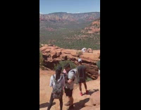 Two girls bend arch back sedona bridge