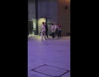 Group of People Watch Another Group Dance