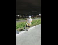 Young boy on scooter jumps on the stairs