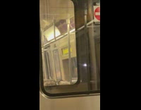 Man does pull ups then nods head after sitting down on subway
