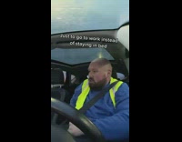 Guy in car sings song about work 