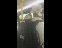 Guy has bird sitting on his backpack in the subway