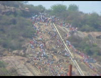 Time lapse people walk up mountain temple 