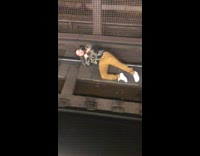 Guy lays on train tracks