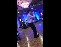 Black tie guy backs into baby microphone