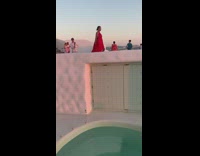 Woman red dress sways her skirt for photoshoot