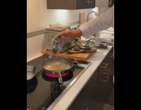 Man pours cognac, sets pan on fire