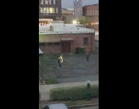 Girl dances LED hula hoop parking lot