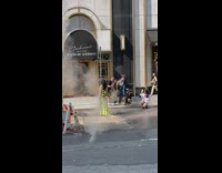 Lady in yellow dress poses in smoke and construction props 