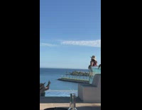 Collab IITW - Woman in bikini poses at the edge of the transparent pool