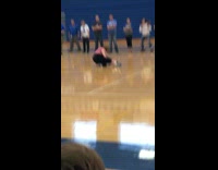 girl in pink dances in basketball court