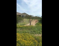 Guy jumps dirt bike grass hill fail
