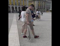 Woman in pink pants tiktok dance at the park