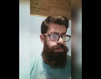 Blue shirt guy no peeing backwards sign 