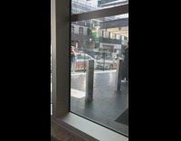 Black pants girl metal poles white cars 