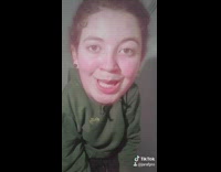 Big head green sweater girl peace sunglasses 