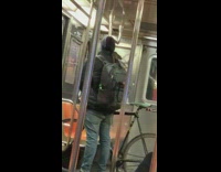 Guy on subway with rat on shoulder