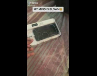 Guy amazed by friends phone jail box