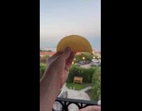 Taco shell shape of an island behind