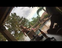 Guy cannonballs into pool off roof