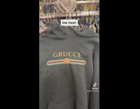 Sweater at thrift store that misspells gucci as grucci