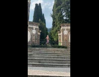 Man shirtless pink shorts fountain villa photoshoot