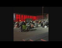 Girl outdoor movie theater scary halloween characters 