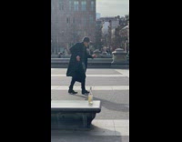 Elderly Man in Coat Dances to Piano Music