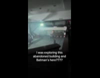 Woman sees man dressed as batman at abandoned building