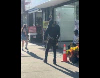 Man walking with pet snake wrapped on body