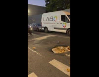 Pothole filled with bagels and box street